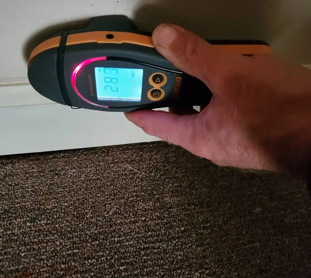 Moisture detection at baseboard during Storm Damage Restoration in Denair